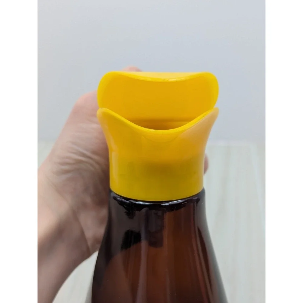 Log Cabin vintage syrup dispenser pitcher amber glass yellow lid patriotic eagle